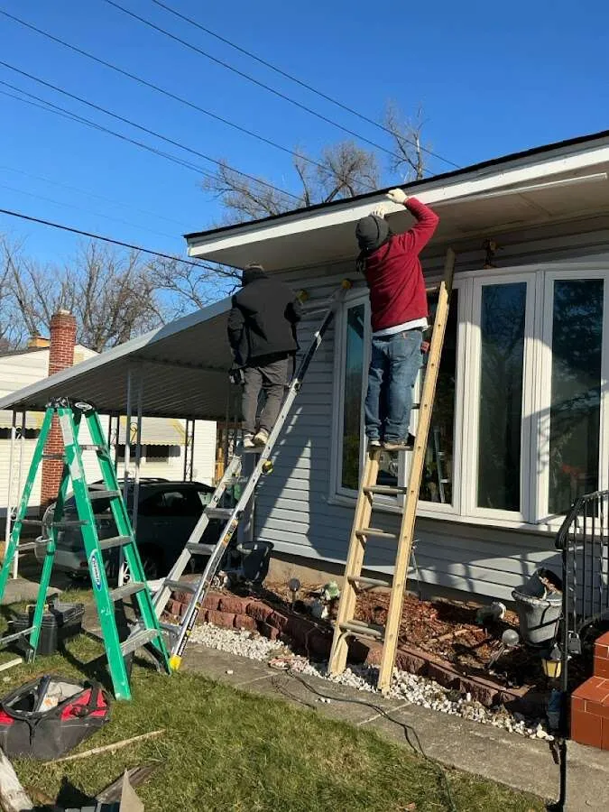 Restoration crew performing exterior repair in Mineola
